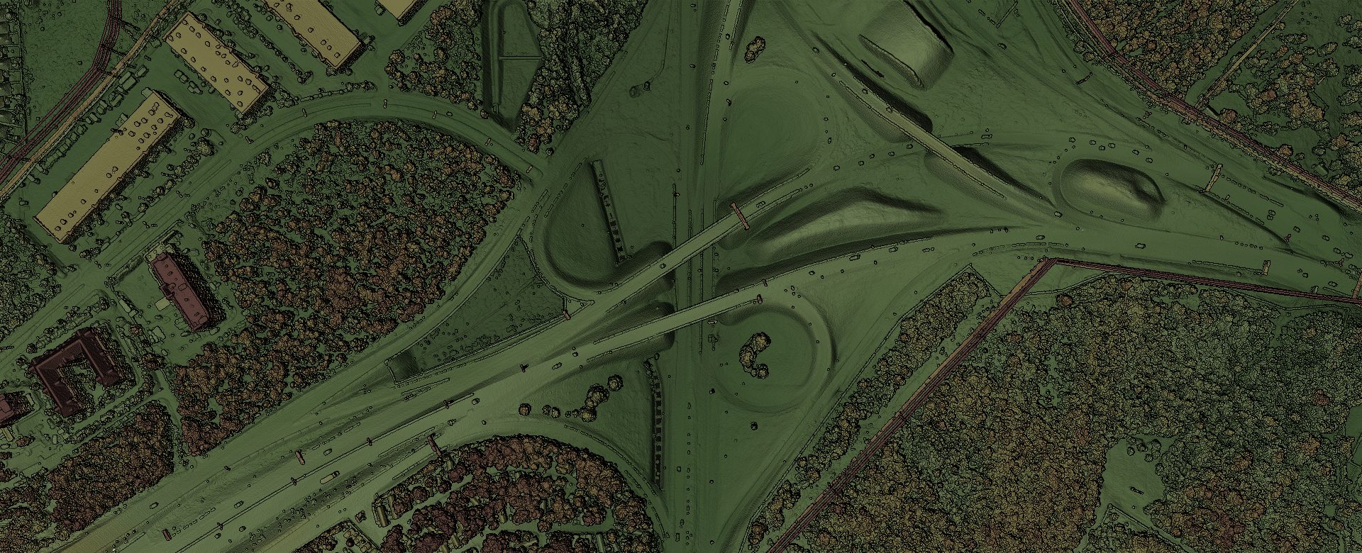 Eine luftgestützte LiDAR-Punktwolke eines Autobahnkreuzes, so schattiert, dass Straße, Boden, Vegetation und Gebäude deutlich unterscheidbar sind.